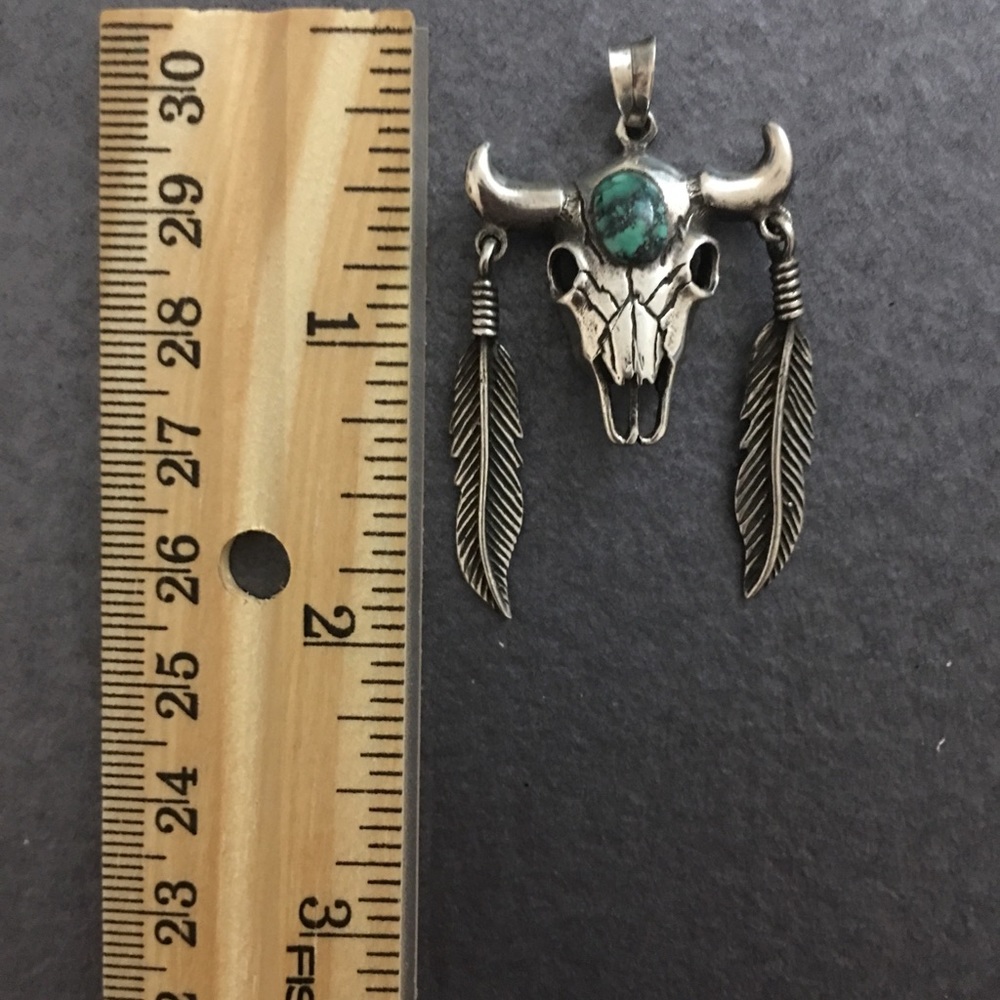 Silver pendant with Turquoise stone.